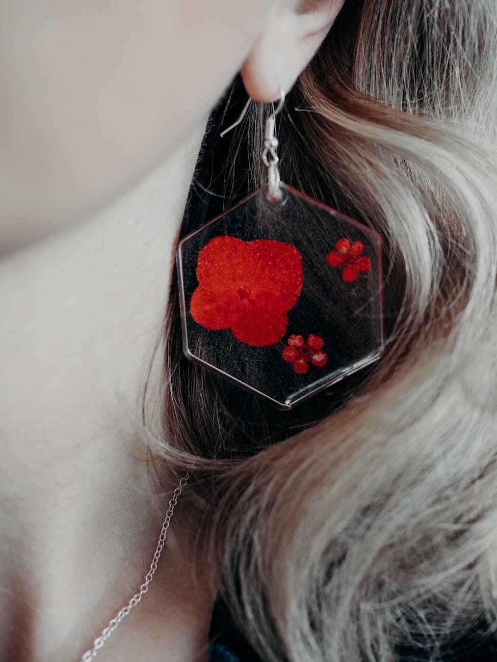 large resin earring with red petals