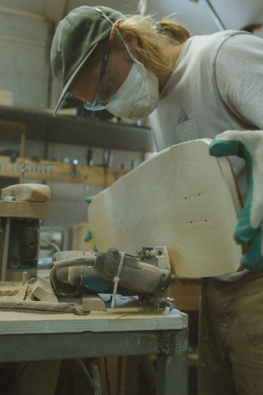 craftsman making a skateboard
