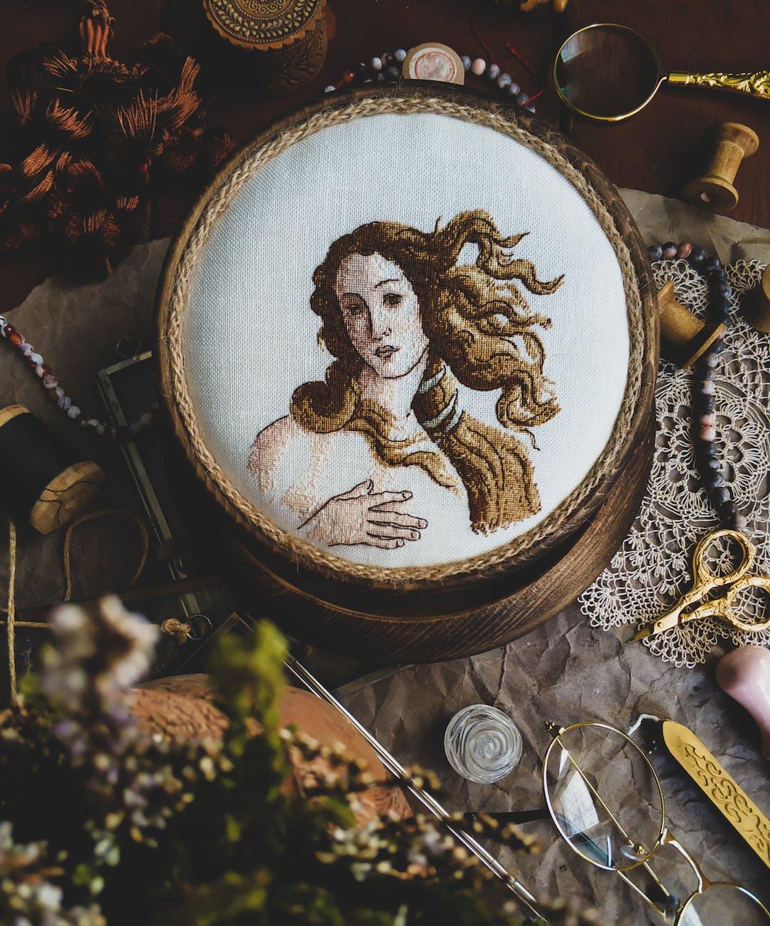 a design of woman on cross stitch project