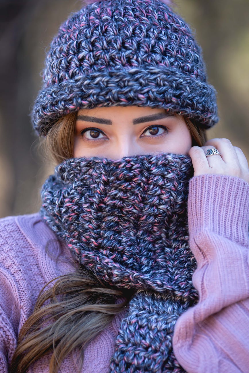 woman with crochet scarf and beanie