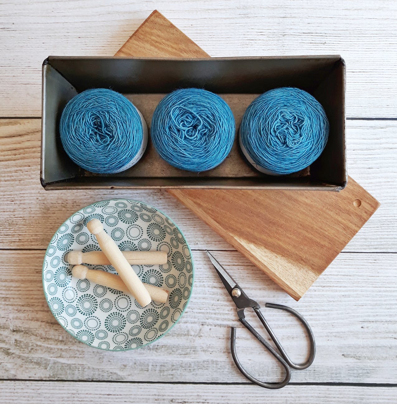three blue yarn threads