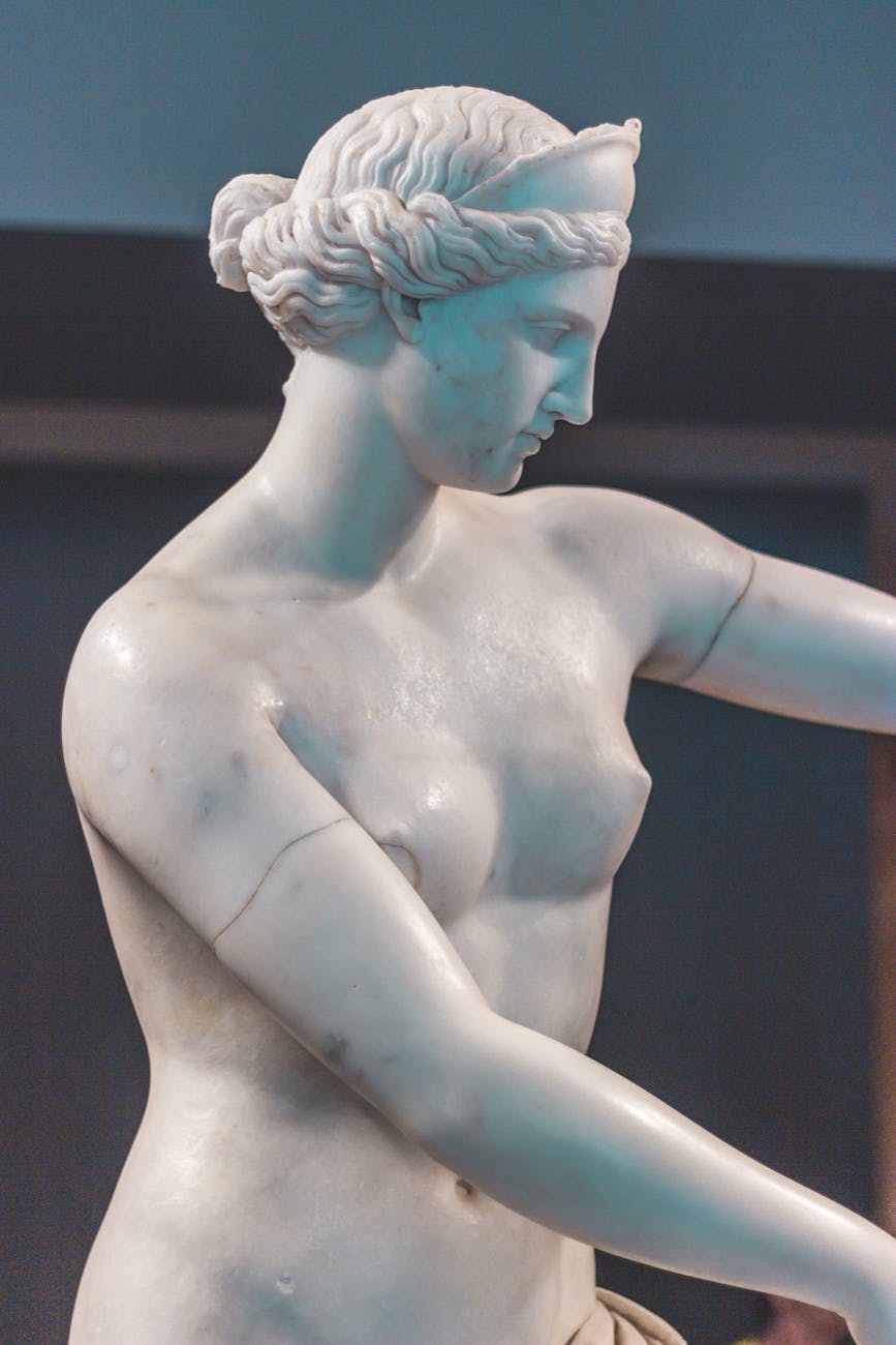 white ceramic statue of a woman