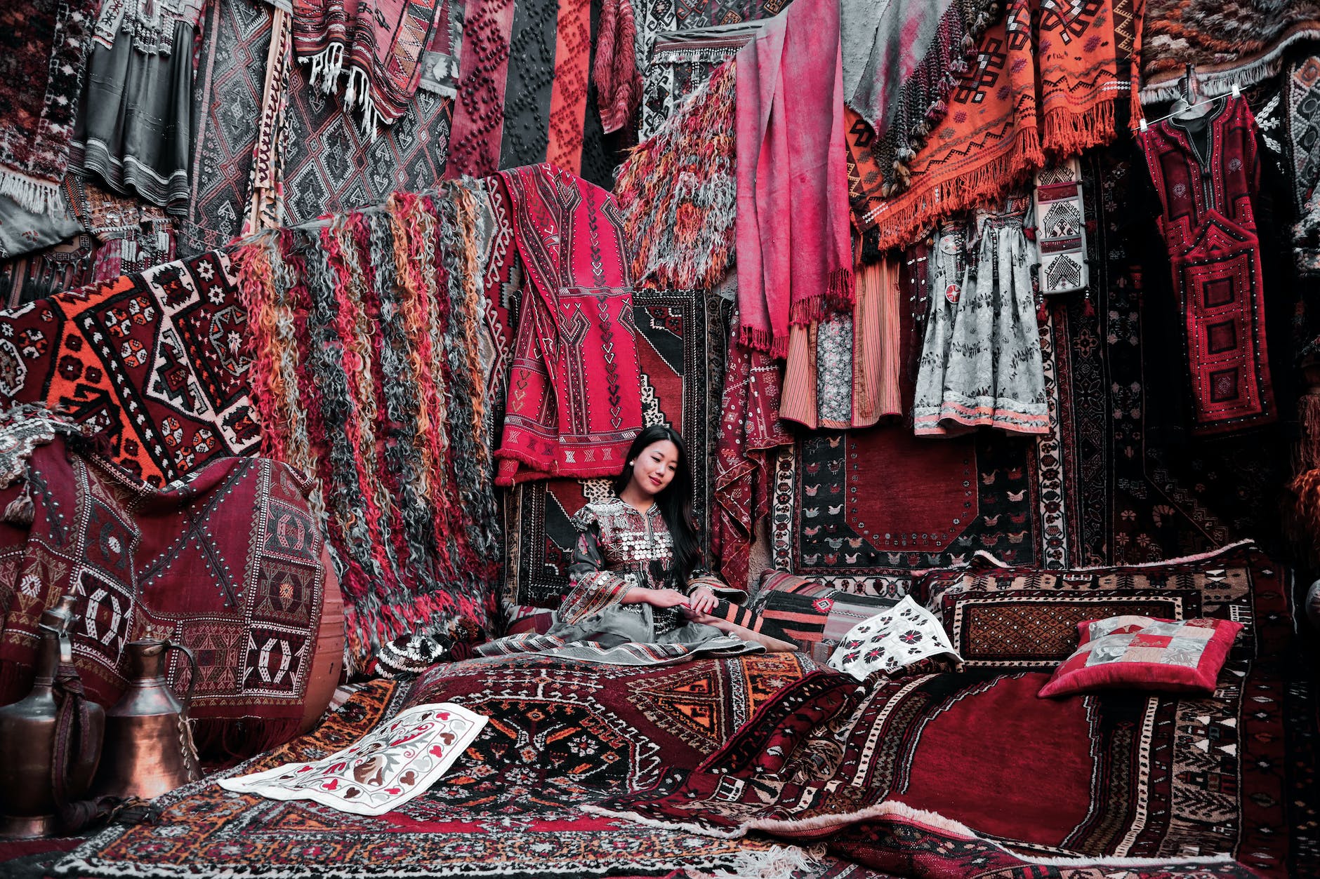 woman sitting on a carpet