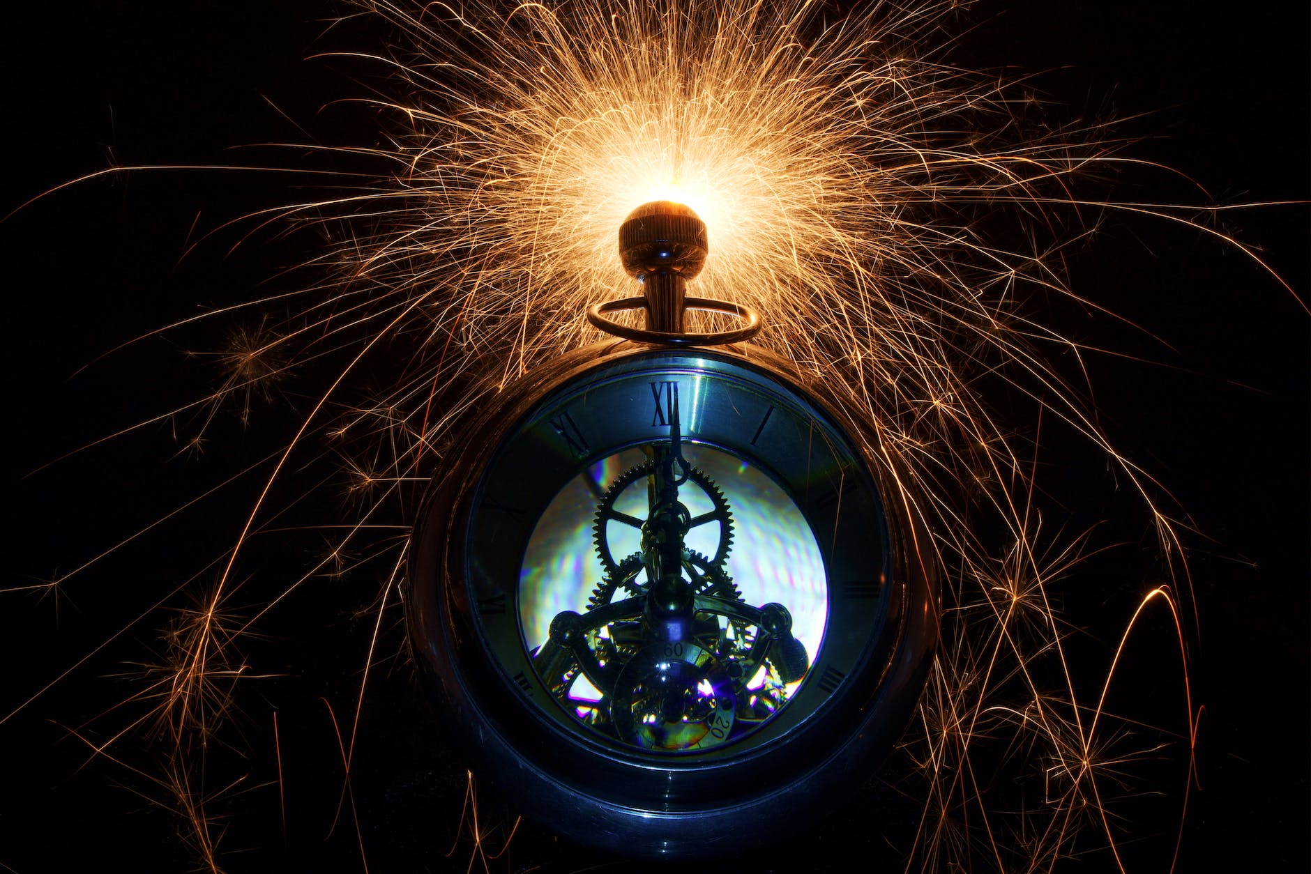 pocket watch with glowing sparks