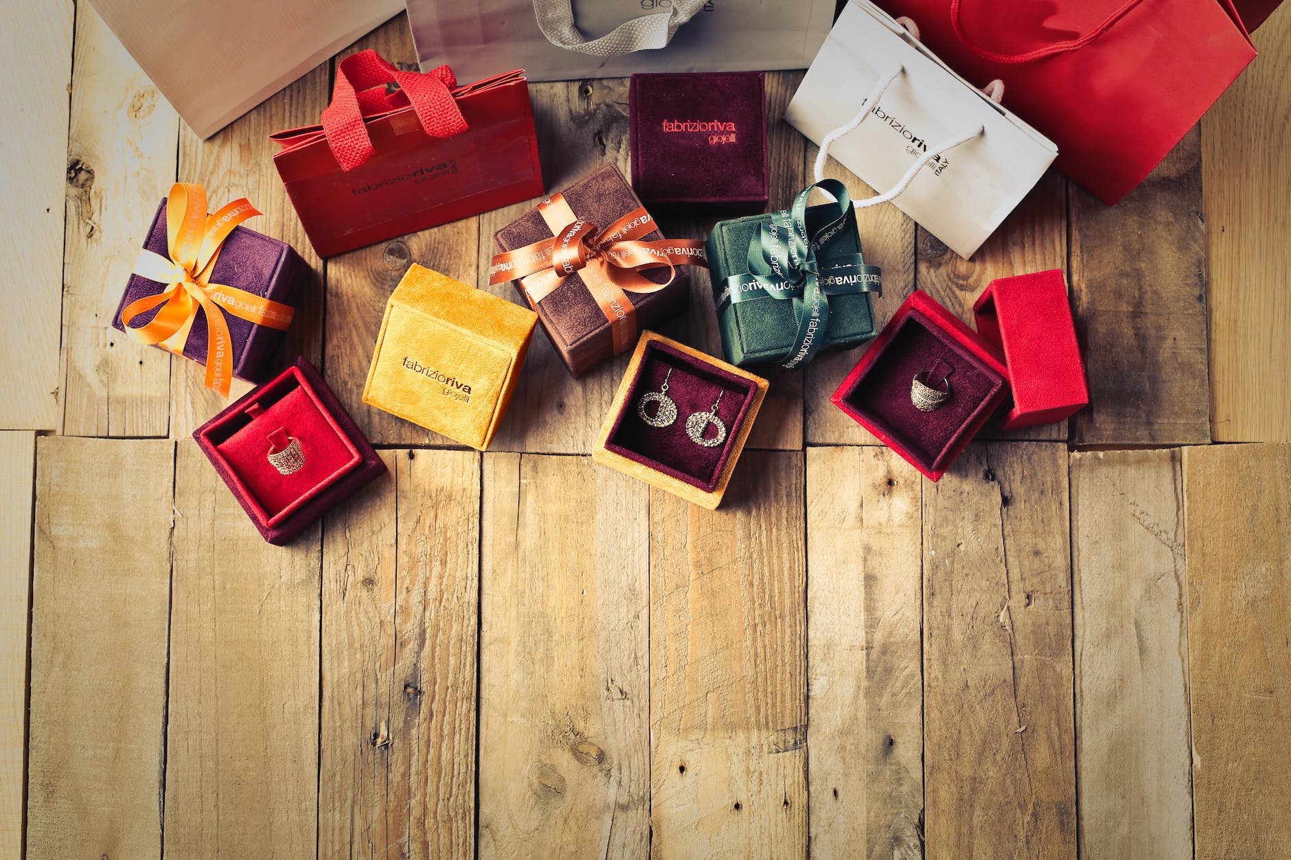 assorted gift boxes on brown wooden floor surface